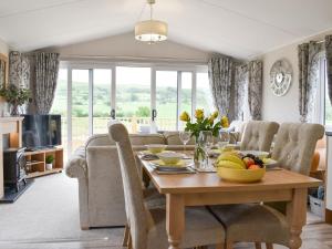 a living room with a table with fruit on it at Lake View - Uk36811 in Whalley