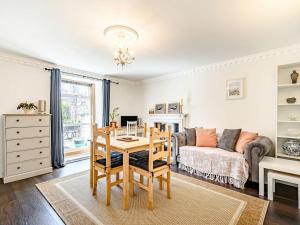 a living room with a table and a couch at The Parade in Berwick-Upon-Tweed