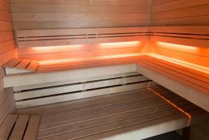 an empty sauna with lights on the inside of it at Gite Kooa Prestige in Theux