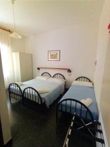 Ein Bett oder Betten in einem Zimmer der Unterkunft Hotel La Pineta