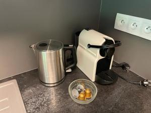 a coffee maker sitting on top of a kitchen counter at Luxury apartment Trio Harrachov A.2 in Harrachov