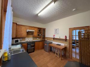 a kitchen with wooden cabinets and a counter top at Elgin apartment in Elgin