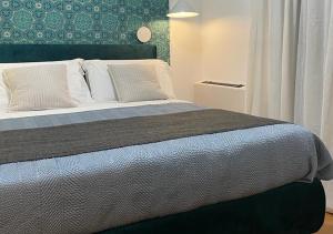 A bed or beds in a room at Tecnopolo Fiera Suite