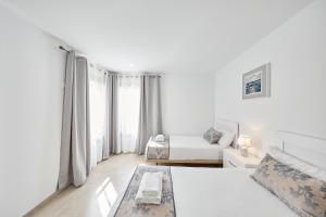 Postel nebo postele na pokoji v ubytování Sonrisa Deluxe Apartments, Levante