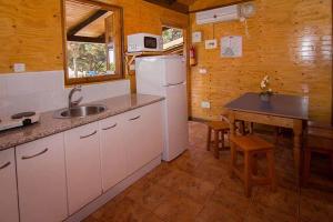 Kuchyň nebo kuchyňský kout v ubytování Complejo Turístico & Camping Cabopino