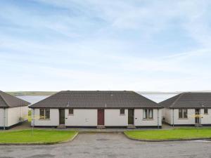 a row of houses in a parking lot at Rockworks Chalets No,3 - Uk7042 in Saint Marys