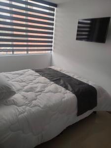 Postel nebo postele na pokoji v ubytování Hotel Cacique