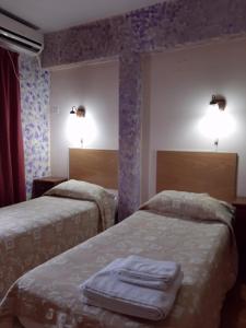 Ein Bett oder Betten in einem Zimmer der Unterkunft La Cascada Townhouse Hotel