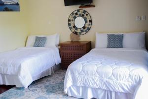 Letto o letti in una camera di Blue Paloma Bed & Breakfast
