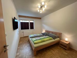 Postel nebo postele na pokoji v ubytování Appartement Heidi II (ohne Balkon/Terrasse)