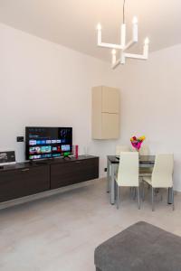 TV a/nebo společenská místnost v ubytování A casa di Ivy e Baby