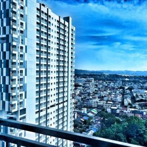 a view of a city from a tall building at SLEPTOPIA at formosa lvl27 budget unit city and sea view in nagoya jodoh in Jodoh