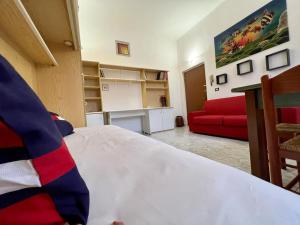 Postel nebo postele na pokoji v ubytování Kibilù - Via Colonna con parcheggio vicinanze Ospedale di Circolo
