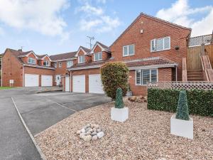 a house with a driveway in front of it at The Paddocks in Ault Hucknall