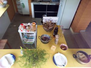 an overhead view of a table in a kitchen with food at Camping Serra Santana in Cavalcante