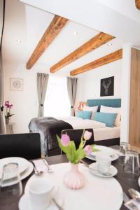 a living room with a couch and a table with a dining room at Your Home - City Apartment in Kufstein in Kufstein