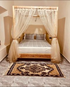 Säng eller sängar i ett rum på Kasbah ben hamou