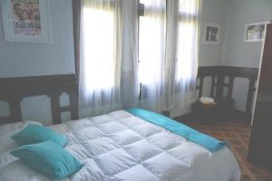 Cama ou camas em um quarto em Hostal Boonen