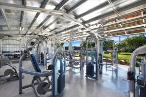 a gym with lots of treadmills and machines at Partial Oceanview 1BR at Kiahuna Plantation Unit 311 in Koloa