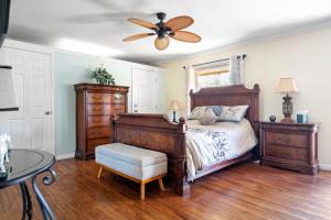 a bedroom with a bed and a ceiling fan at Sedona Quail Hollow Retreat in Sedona