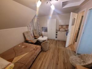 a living room with a couch and a table at Dom gościnny Monika in Pobierowo +52 photos