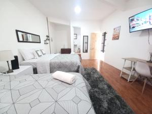 Ένα ή περισσότερα κρεβάτια σε δωμάτιο στο W's Hostel