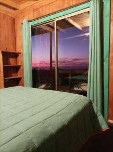 Säng eller sängar i ett rum på Cabaña completa Lodge la Quebrada