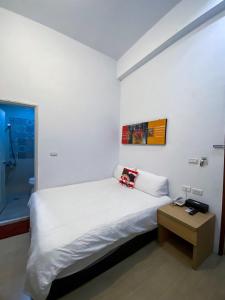 Postel nebo postele na pokoji v ubytování Kenting Bayview Hotel