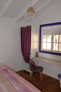 Postel nebo postele na pokoji v ubytování Jardin des Anges-Bungalows créoles et studio
