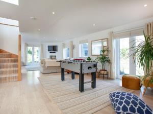 a living room with a ping pong table in it at Lark Rise in Northam