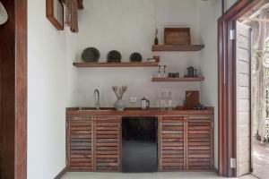 a kitchen with a counter with a sink and a sink at Hotel Boutique TerraNova in Tulum
