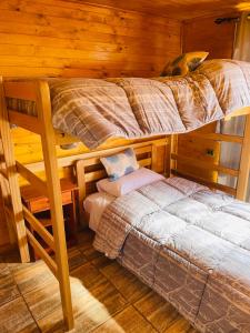 Postel nebo postele na pokoji v ubytování ELUNEY Combarbala