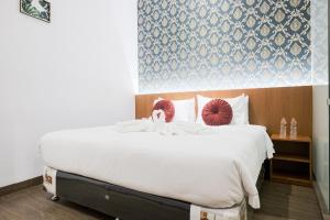 Voodi või voodid majutusasutuse King's Palace Medan RedPartner toas