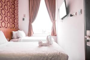 Voodi või voodid majutusasutuse King's Palace Medan RedPartner toas