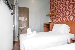 Voodi või voodid majutusasutuse King's Palace Medan RedPartner toas
