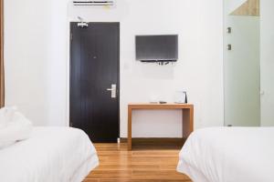 Voodi või voodid majutusasutuse King's Palace Medan RedPartner toas