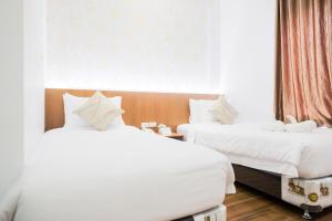 Voodi või voodid majutusasutuse King's Palace Medan RedPartner toas