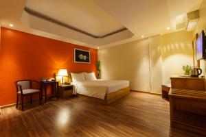 Postel nebo postele na pokoji v ubytování Roseland Corp Hotel