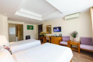 Postel nebo postele na pokoji v ubytování Roseland Corp Hotel