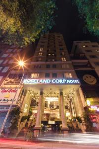 a large building with a sign on the front of it at Roseland Corp Hotel in Ho Chi Minh City