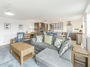 a living room with a couch and a table at Alnwick Pad in Alnwick