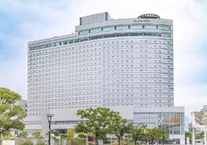 a large white building with a sign on it at Tokyo Bay Ariake Washington Hotel in Tokyo