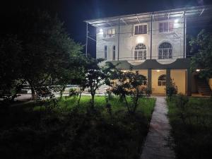 a large building with lights on the side of it at H&L Coworking and Live in Jrvezh