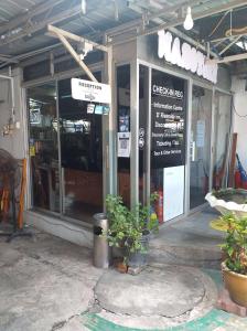 a store front of a store with glass doors at D Riverside Inn in Malacca