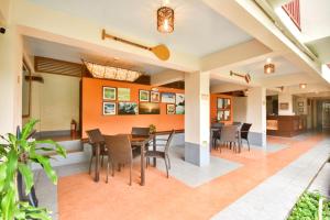a dining room with a table and chairs at Agos Boracay Rooms + Beds in Boracay