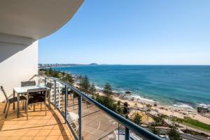 a balcony with a view of the beach at Mantra Mooloolaba Beach in Mooloolaba