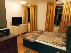 Posteľ alebo postele v izbe v ubytovaní Apartamenty Zakładowa