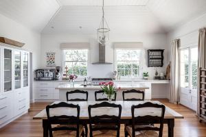 a kitchen with a table and chairs in a room at Chatsworth Tasmania in Longford