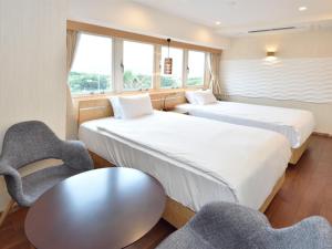 Postel nebo postele na pokoji v ubytování BREATH HOTEL