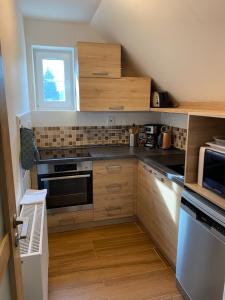 Kuchyňa alebo kuchynka v ubytovaní Apartmán 430